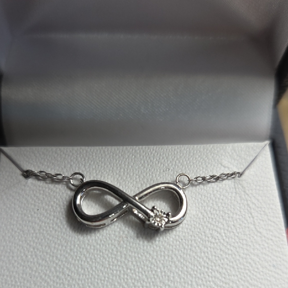 Elegant 18" Sterling Silver Infinity Necklace with Diamond Accent